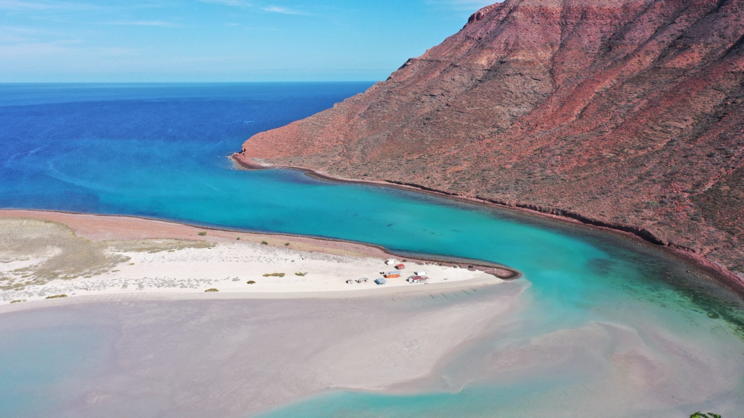 Aerial view of a turquoise cove and coastline in Baja California Sur near Los Cabos