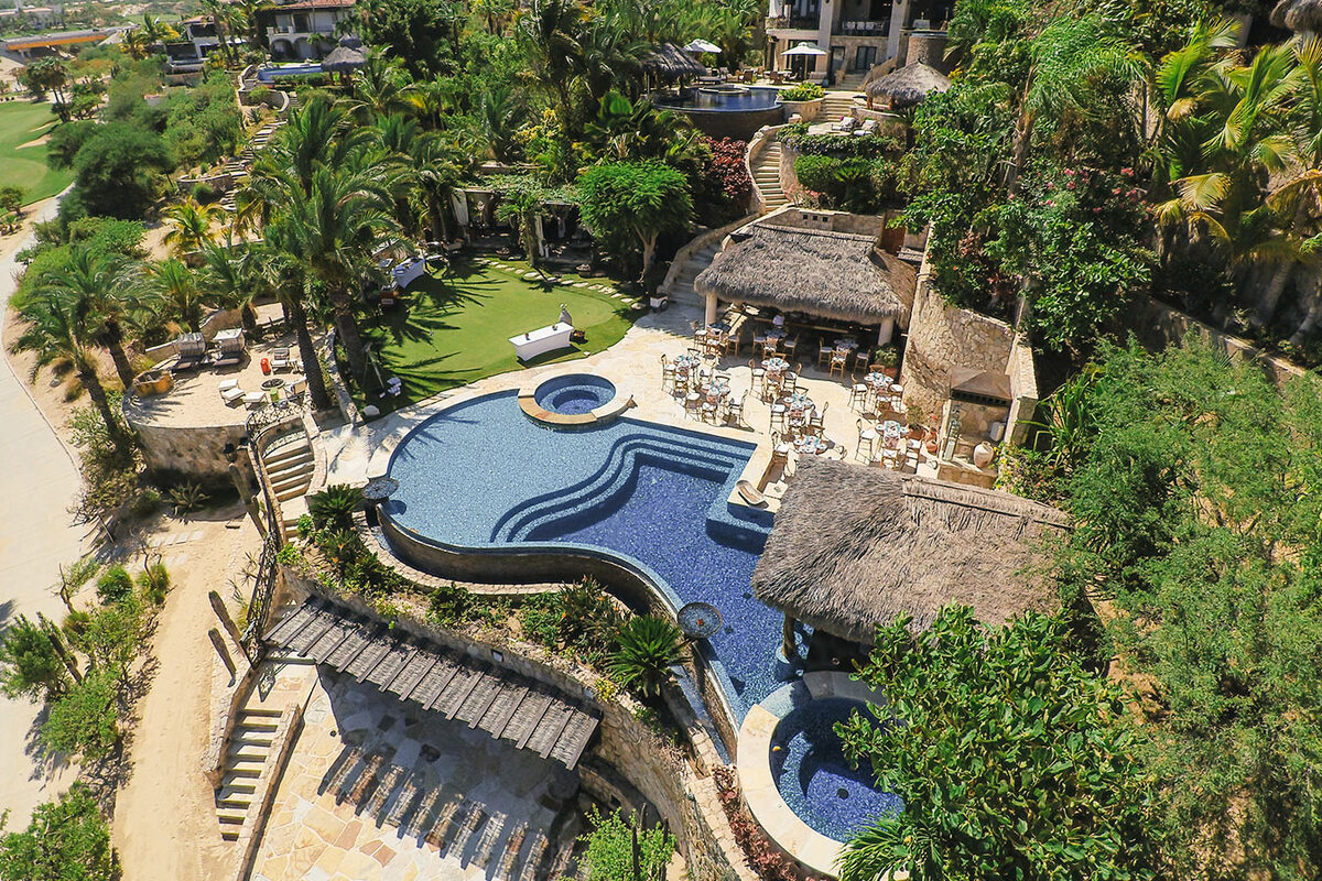 Aerial of a private villa pool and palapa in Los Cabos